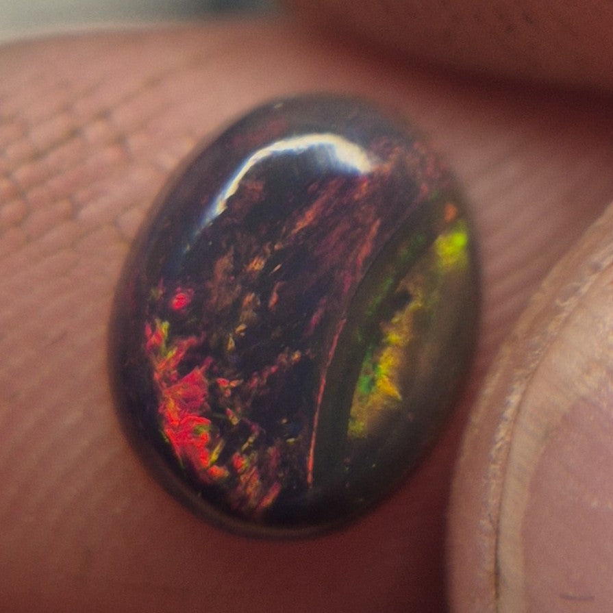 1.00ct Smoked Ethiopian Welo Opal – Oval Cabochon Fiery Red & Green Flash